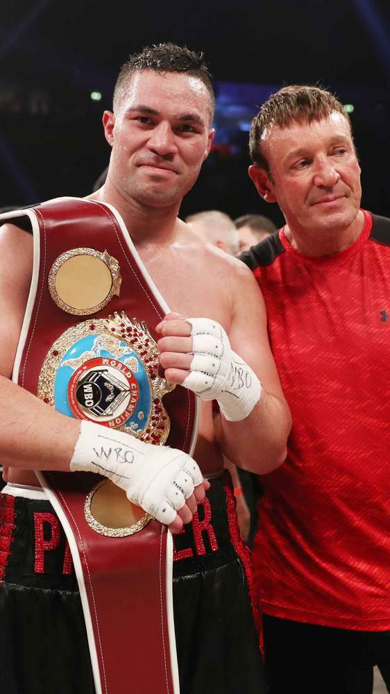 Parker with his WBO belt, and trainer Barry. Picture: Andrew Cornaga\/Photosport