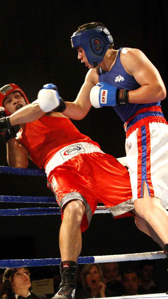 Parker, in blue, against three-time New Zealand amateur champion Yamiko Chinula. Picture: Jonathan Cameron\/Stuff