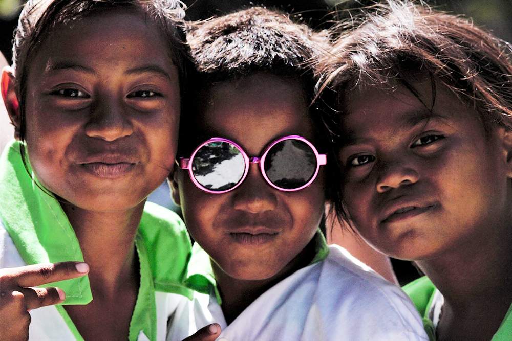 Children posing for the camera.PHOTO: CHARLIE MITCHELL\/STUFF