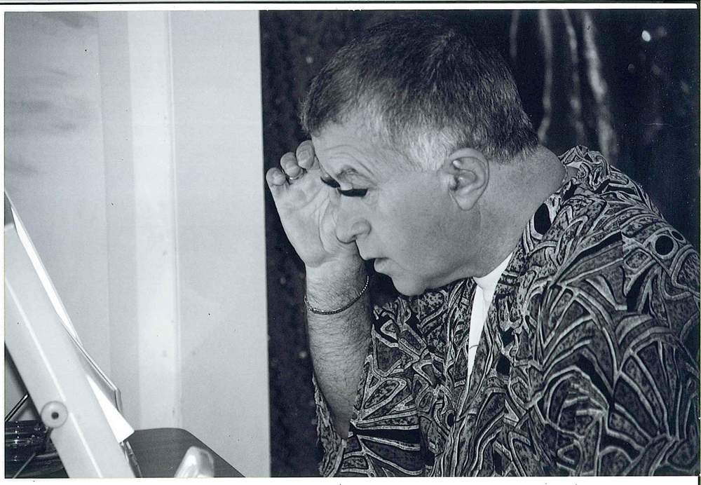 Marcus Craig adjusts his false eyelashes for the backstage transformation into the brassy, filthy-minded Diamond Lil. CREDIT: CHRIS POWLEY COLLECTION