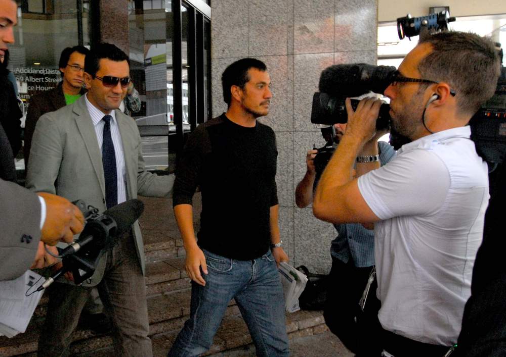 Rob Mokaraka (sunglasses, left) leaves the Auckland District Court after pleading guilty to four charges related to events around him being shot and wounded by armed police. (MICHAEL FIELD\/STUFF) 