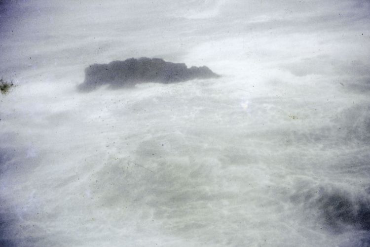  A rock at Barrett Reef emerges from the murk, as the powerless Wahine drifts into the harbour. DAVID HENDY/WELLINGTON MUSEUMS TRUST COLLECTIONS (2006.5070.6)