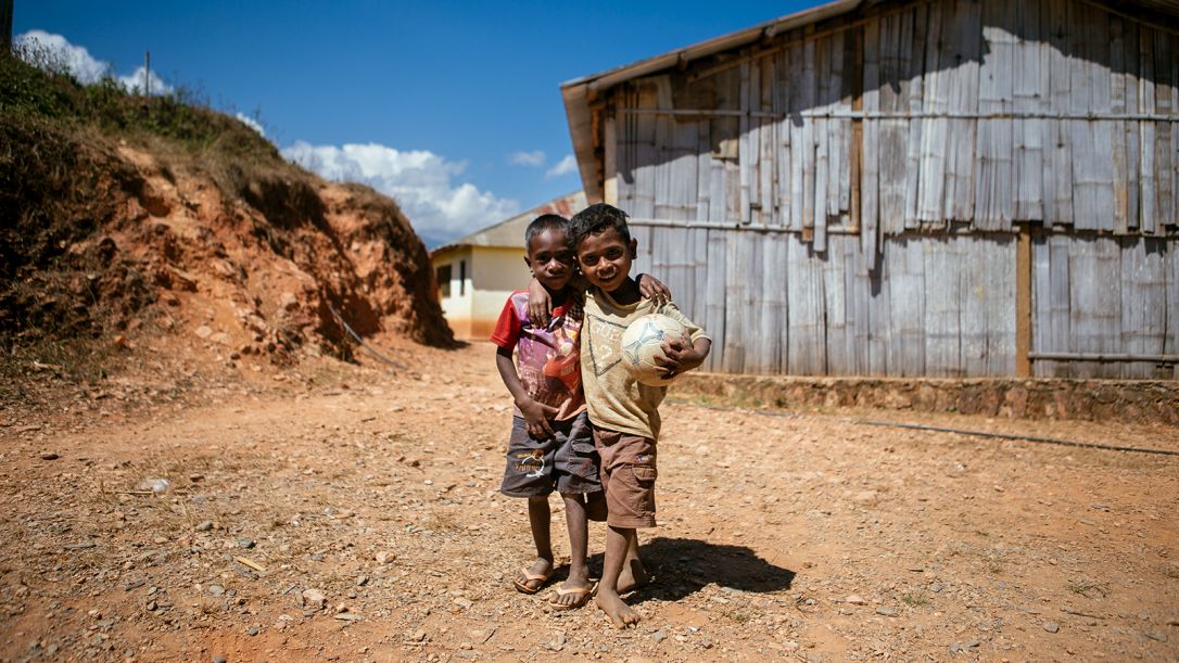 Two young children take a break from balla