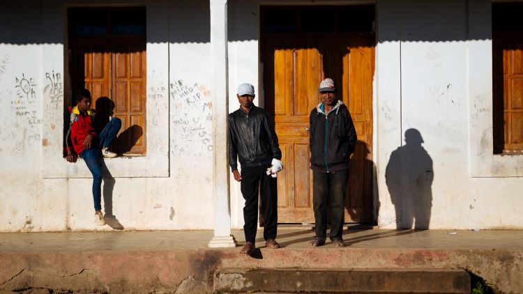 Men in front of building