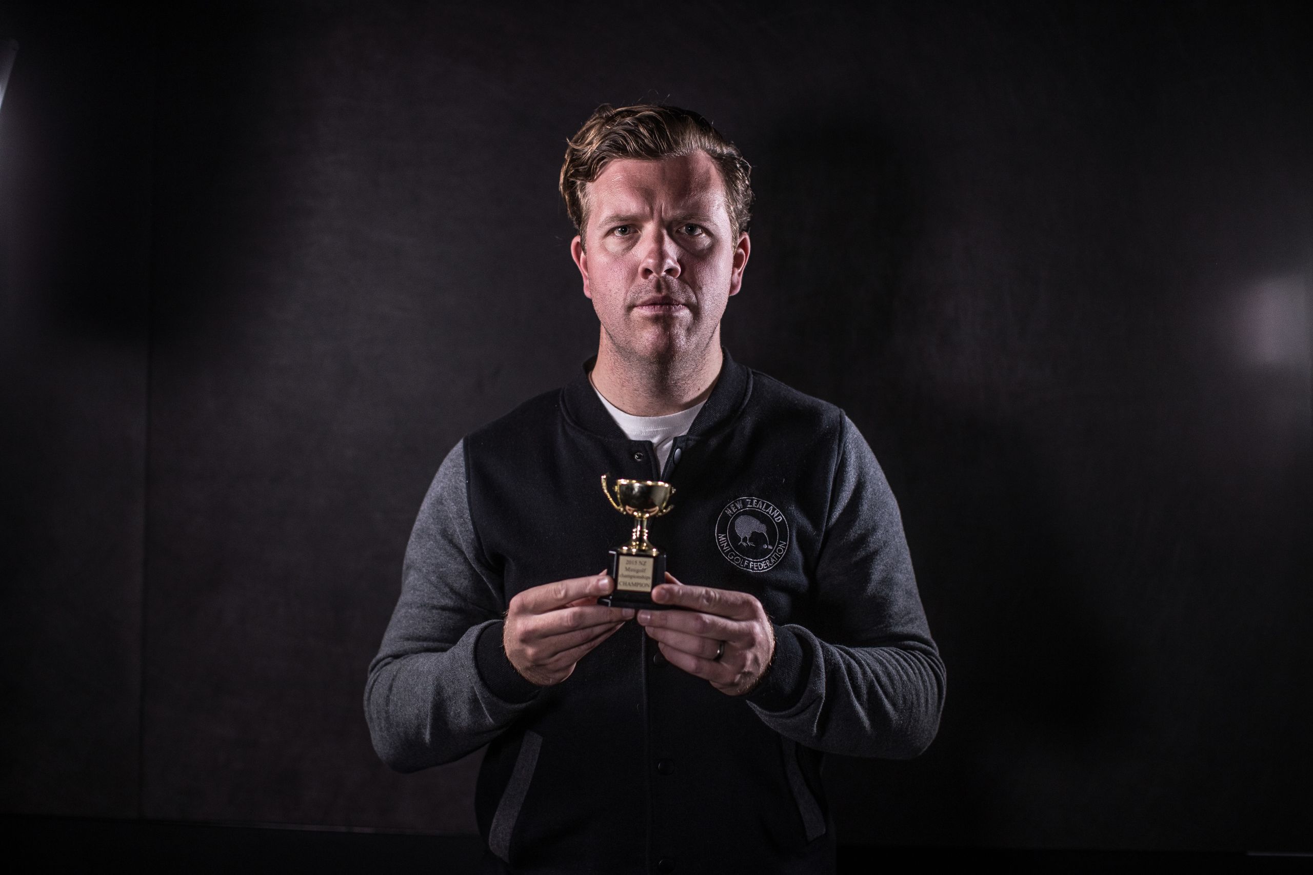 Ollie Hicks, founder and first president of the NZ Mini Golf Federation, with his 2015 national champions' trophy. JASON DORDAY/STUFF