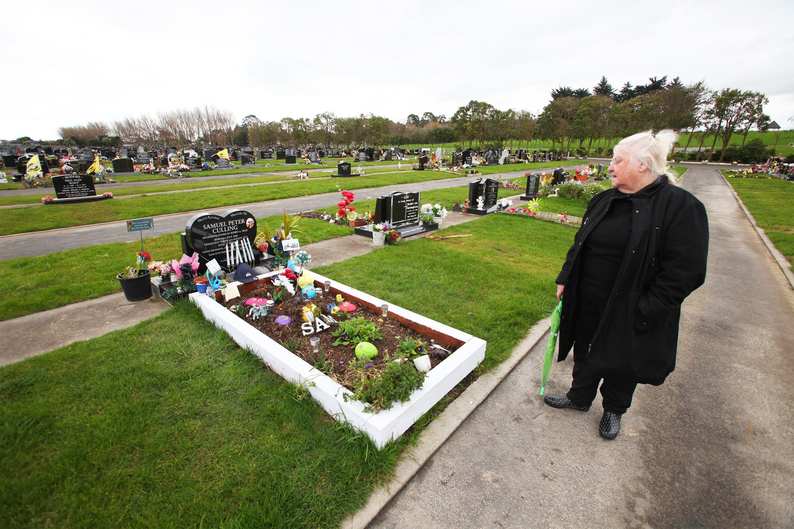 Trina Culling stands by Sam's grave