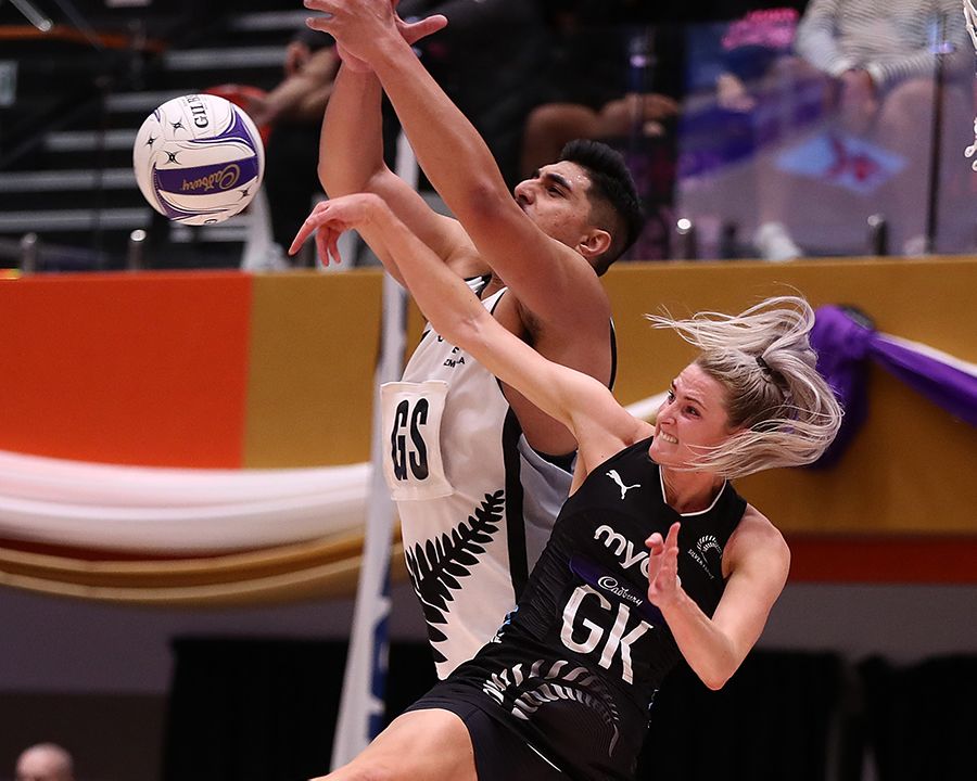 Jane Watson and Junior Levi compete for the ball