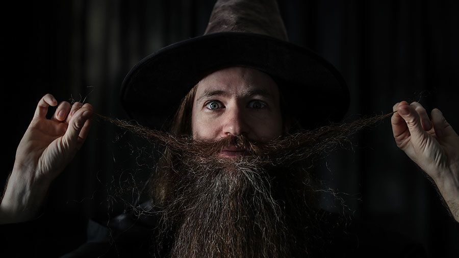 Ari gleefully twiddling with his long moustache.