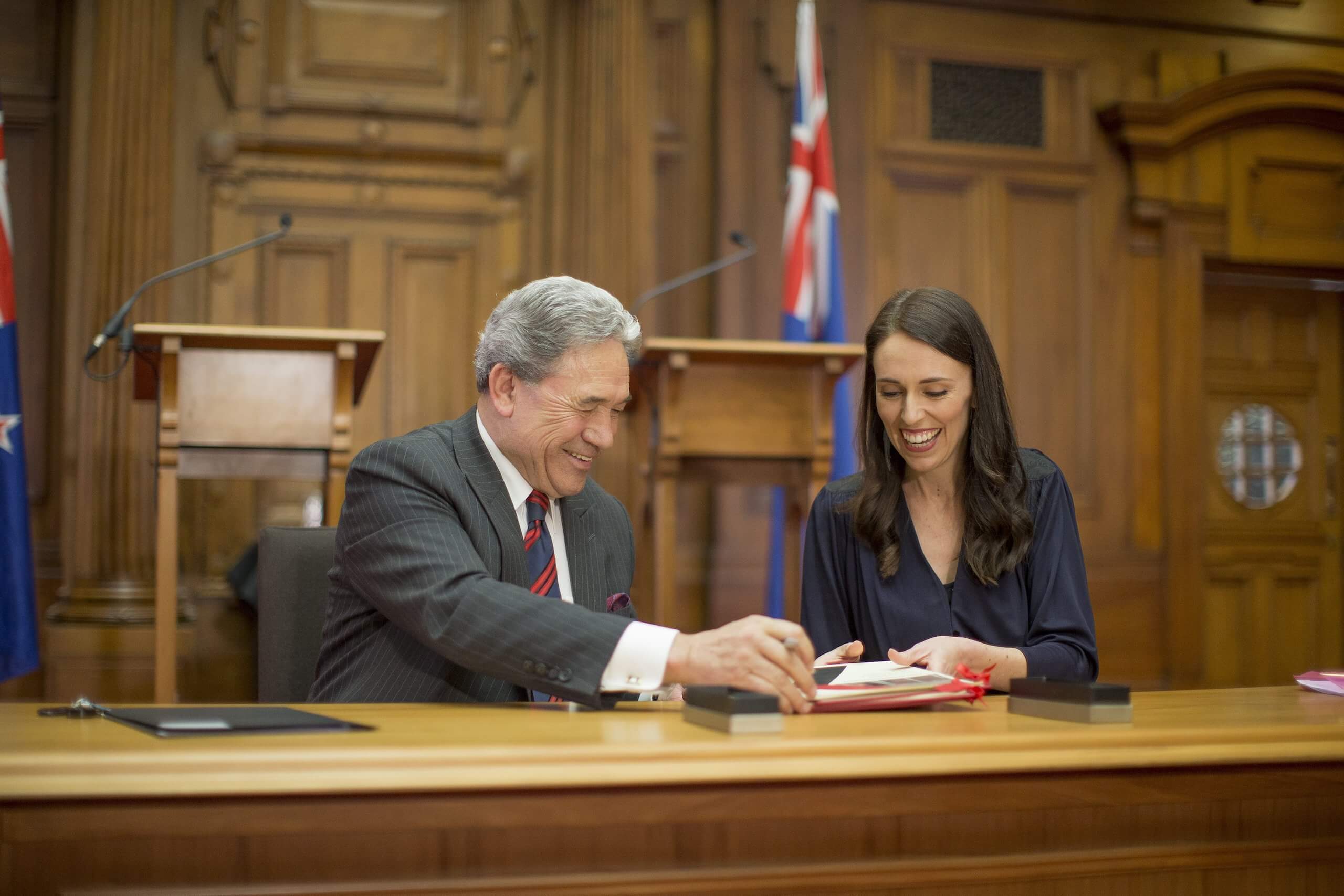 Winston Peters and PM-elect Jacinda Ardern sign the coalition agreement in Parliament today. Credit: Robert Kitchin / Stuff