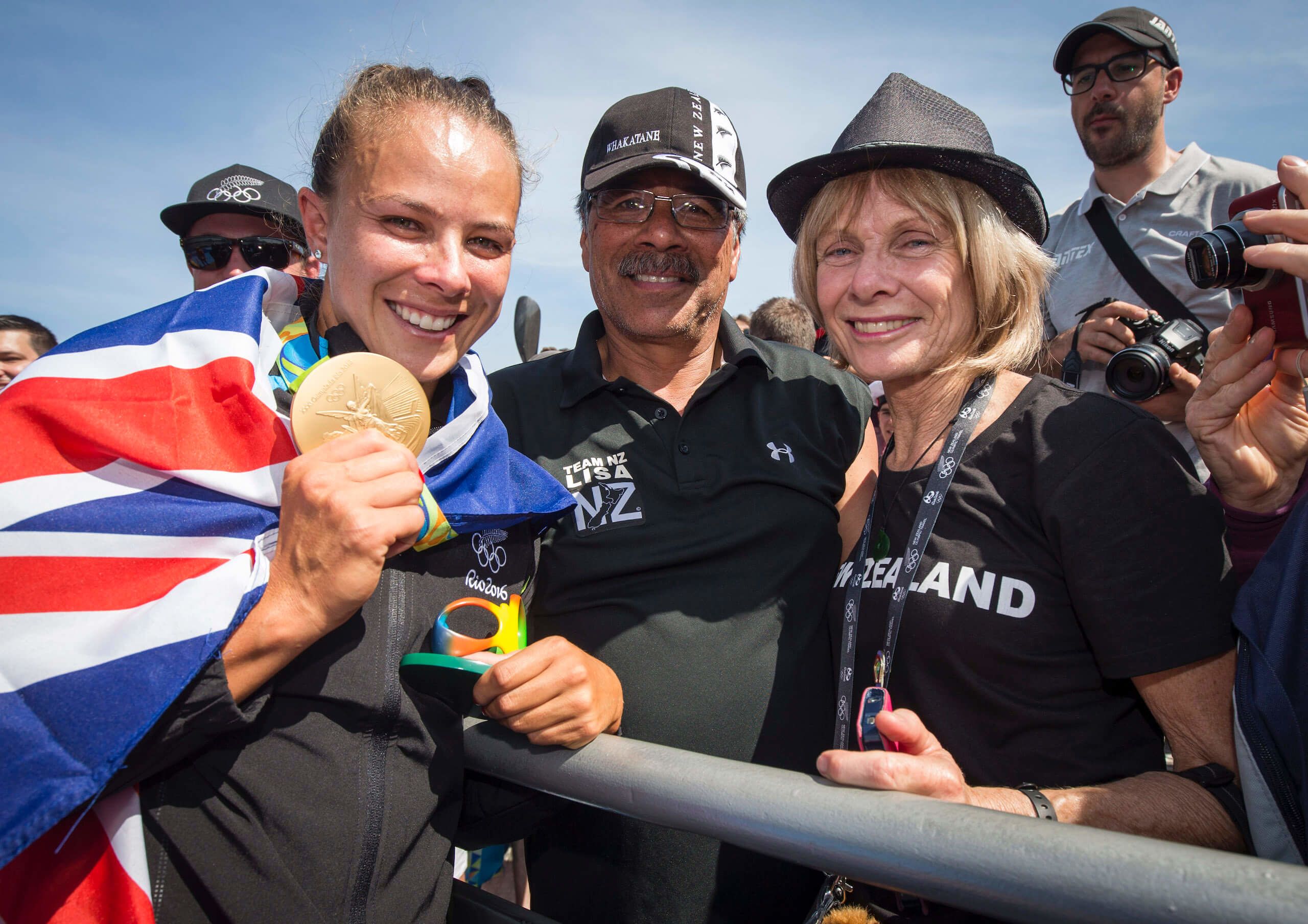 New Zealand's Lisa Carrington celebrates with her family after winning gold in the womens k1 200m at Lagoa Stadium, Olympic rowing. Rio Olympics Games 2016, Rio de Janeiro. Tuesday 16 August, 2016. Credit: John Cowpland / Photosport