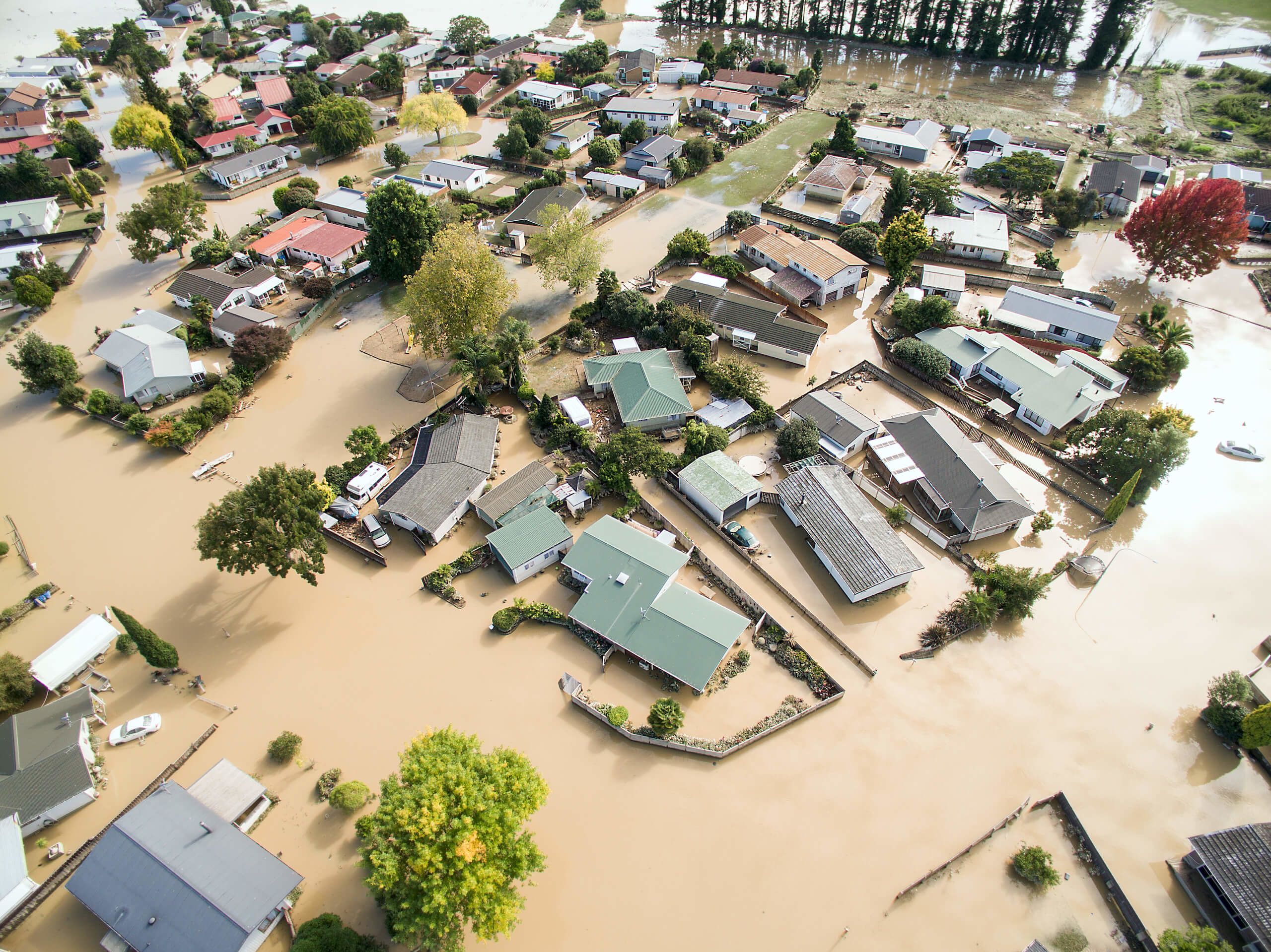 Receding floodwaters reveal the damage to Edgecumbe after a flood bank was breached on Thursday morning. Credit: CHRIS McKEEN / STUFF