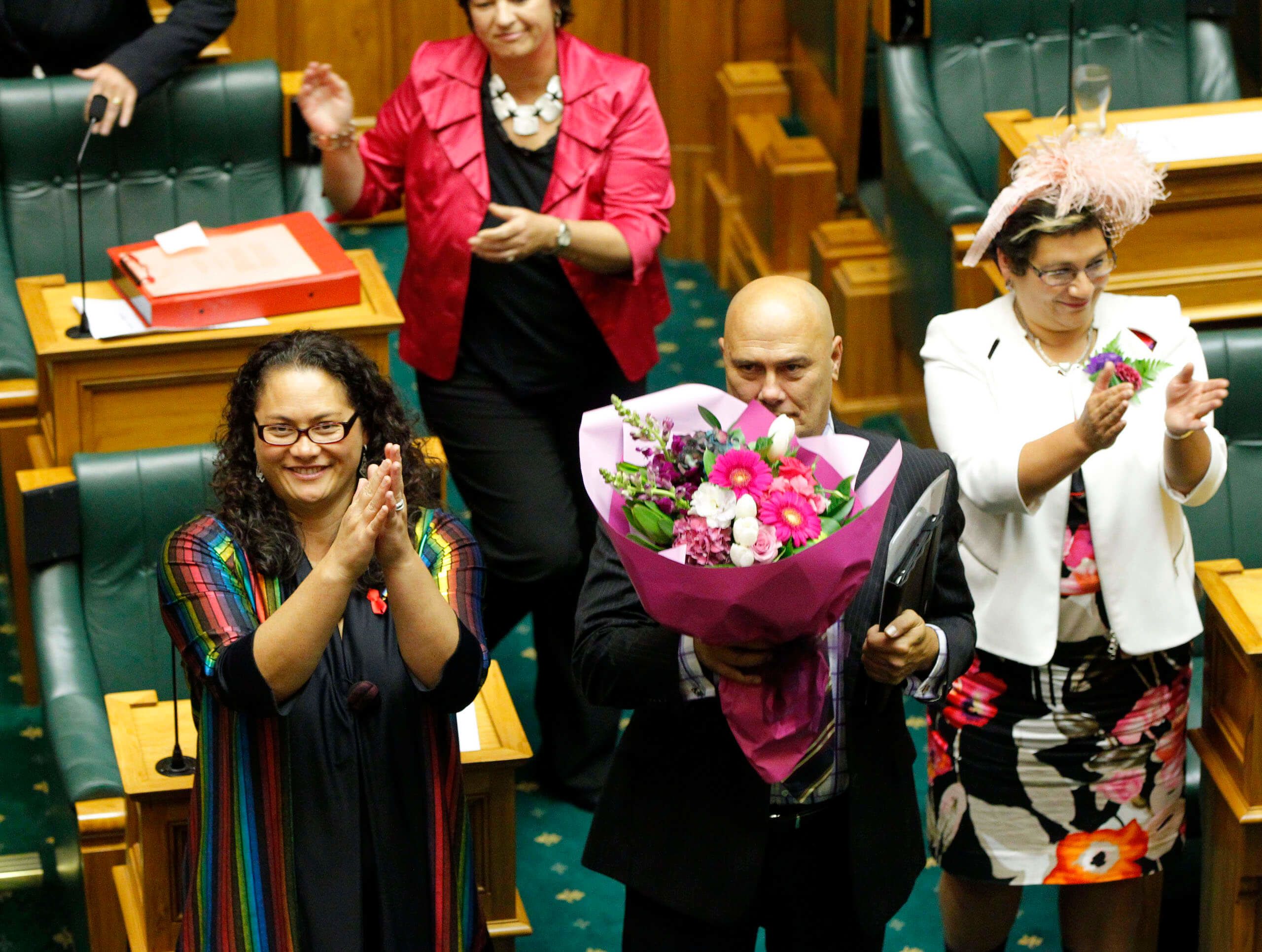 MP Louisa Wall, left Tau Henare and Metiria Turei celebrate winning the vote 77-44 at the last reading of the Marriage Equality Bill at Parliament. Credit: Ross Giblin / Stuff