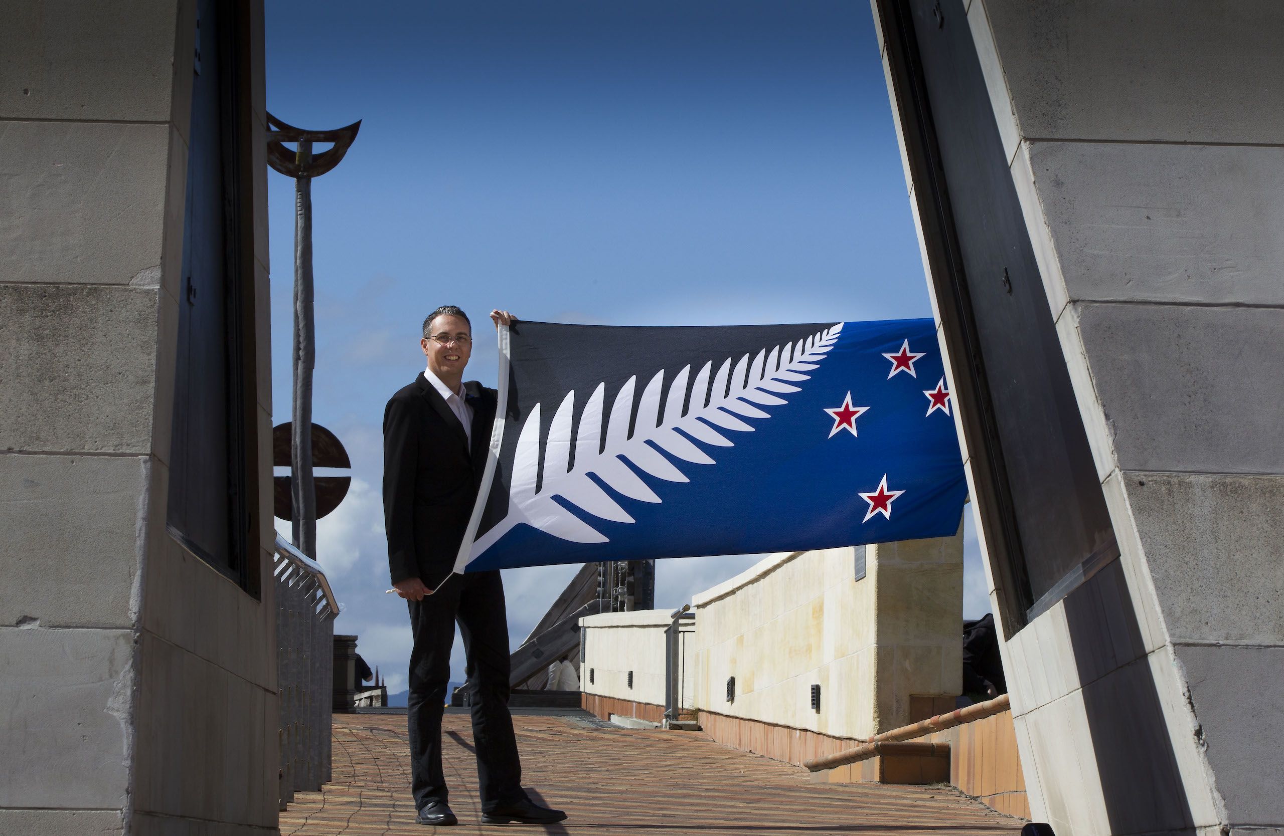 Kyle Lockwood with his silver fern flag ahead of the final result of the flag referendum. Credit: Ross Giblin / Stuff