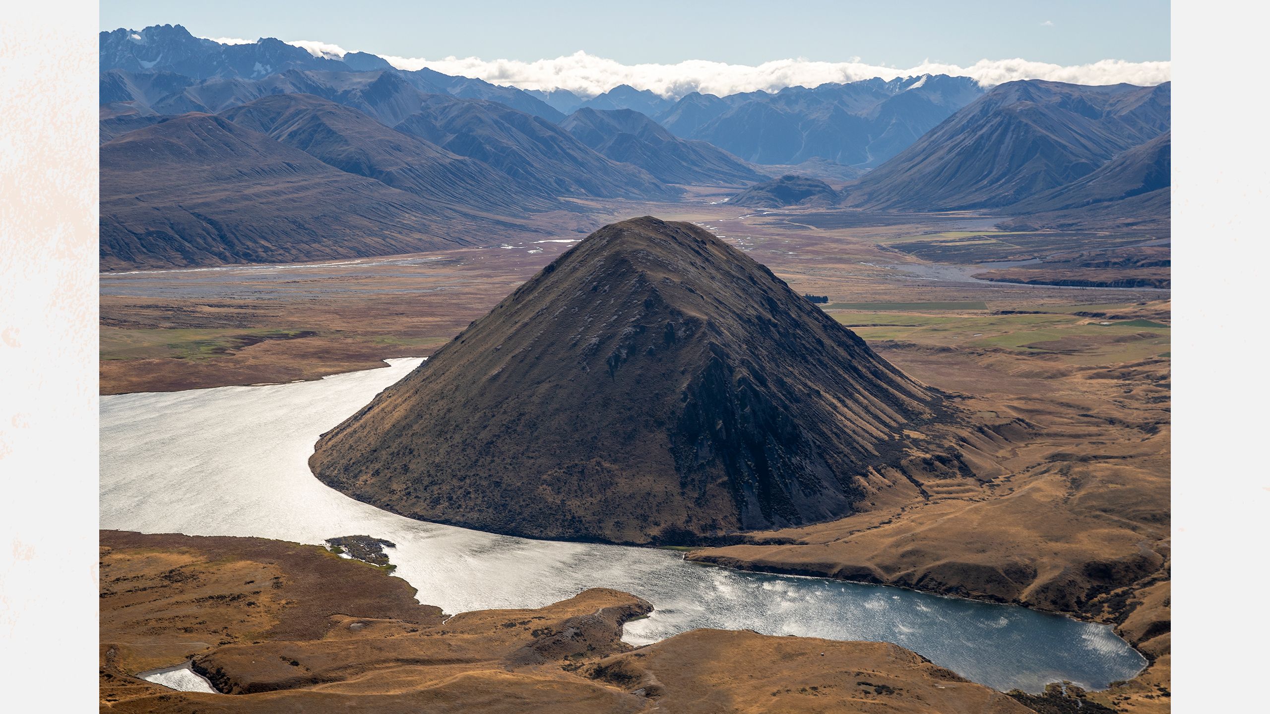 Aerial of Lake Heron Station in Canterbury.Large conical hill at its centre.