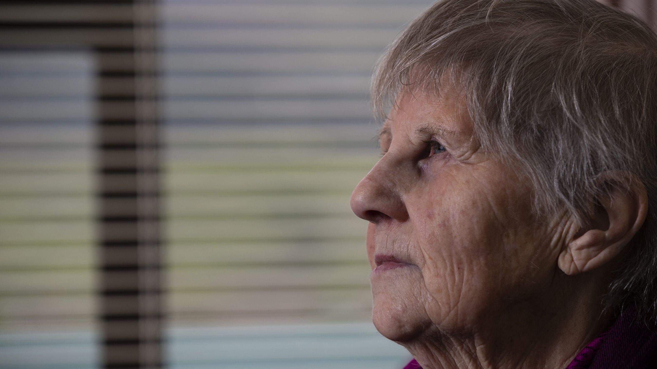 Profile of Boyd's sister looking left.