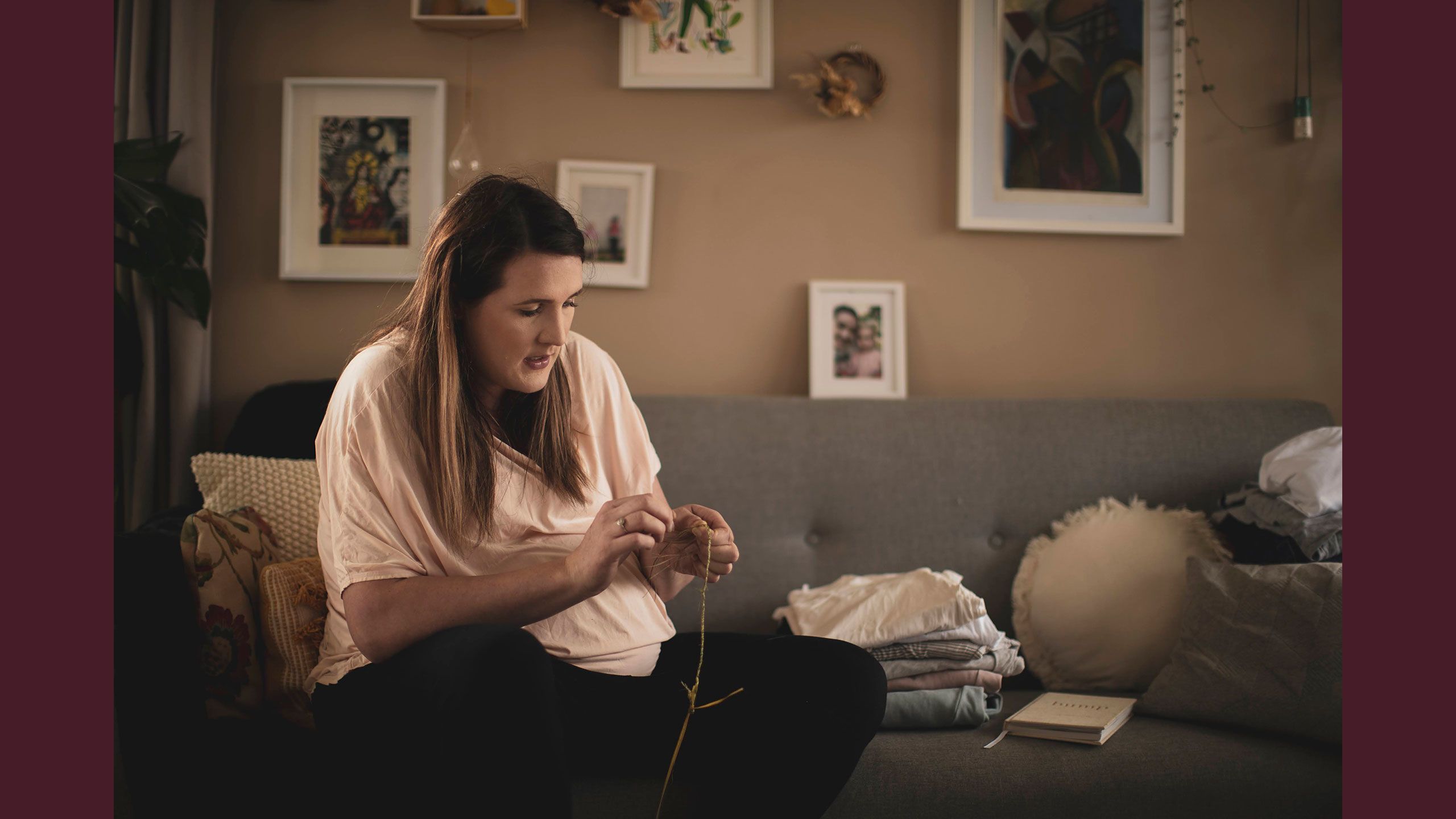 Jessica holds some harakeke (in her hands weaving a small plait.