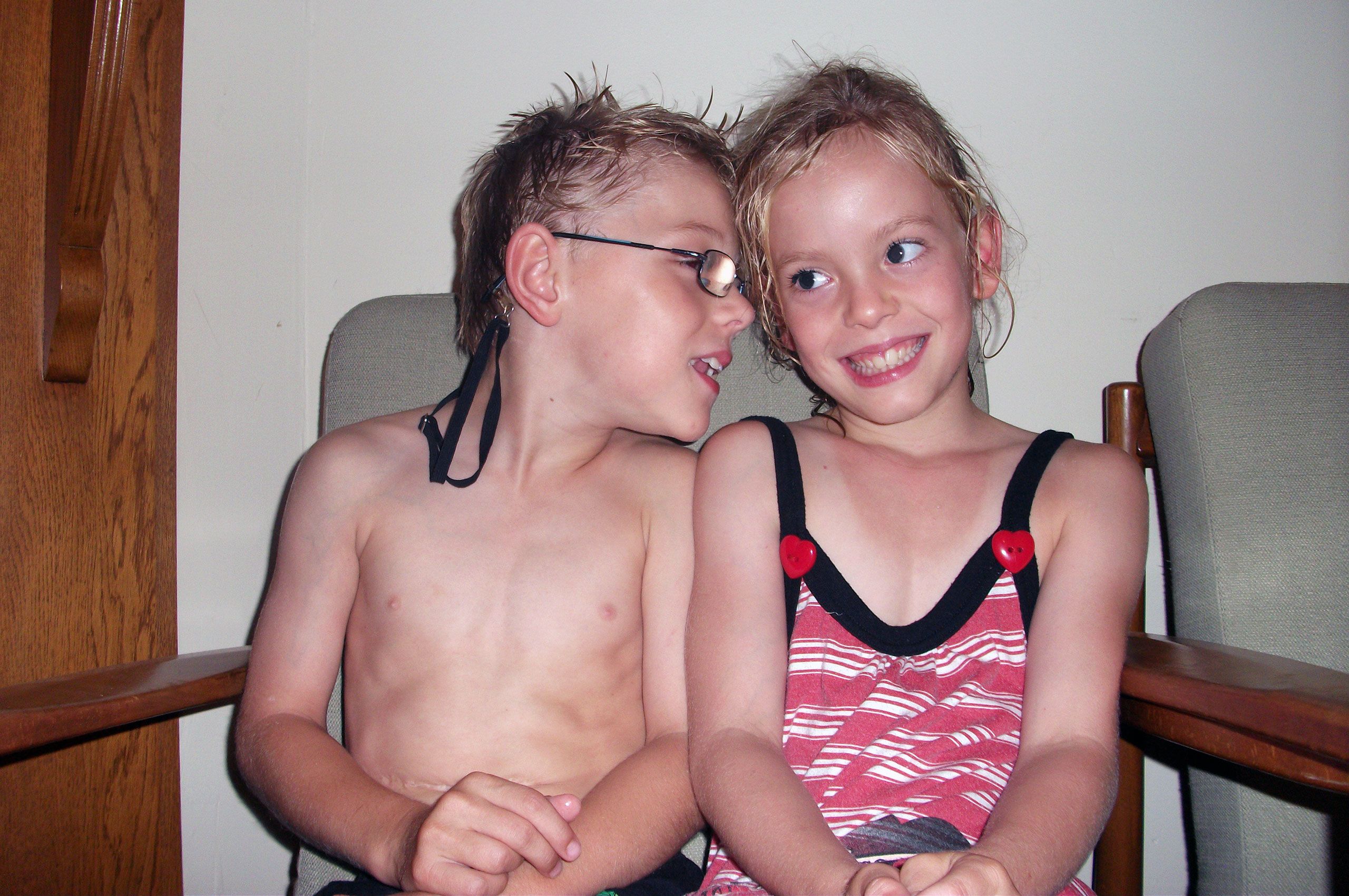 Mac and India in their togs again. India is smiling and facing the camera. Mac is looking towards India.