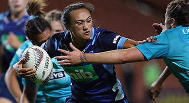 Ruahei Demant of the Blues breaks a tackle