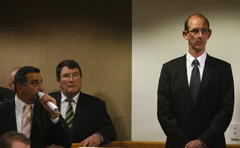 Joe Karam watches Bain as he stands in the dock facing the charges at the start of his second trial. Joe Karam watches Bain as he stands in the dock facing the charges at the start of his second trial.